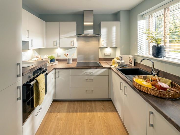 a kitchen with white cabinets