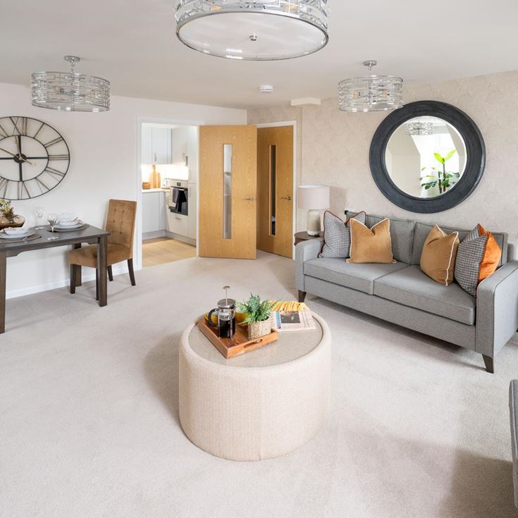 a living room with a couch and a round table