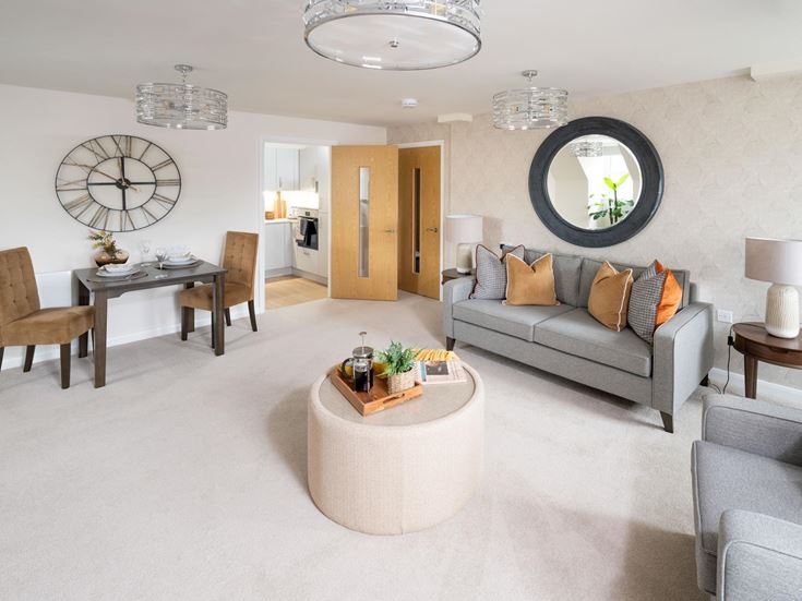 a living room with a couch and a round table
