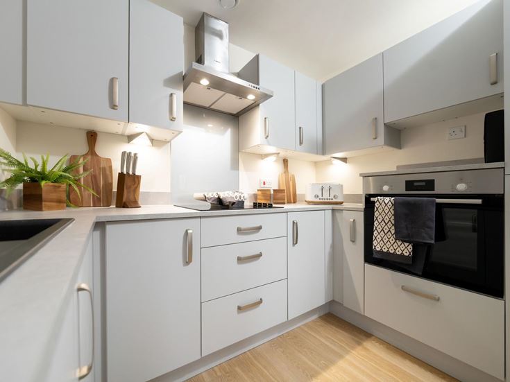 a kitchen with white cabinets