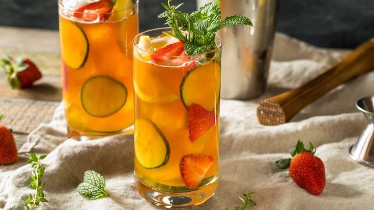 a group of glasses with fruit in them