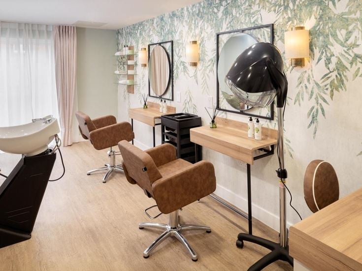 a room with a mirror and a desk