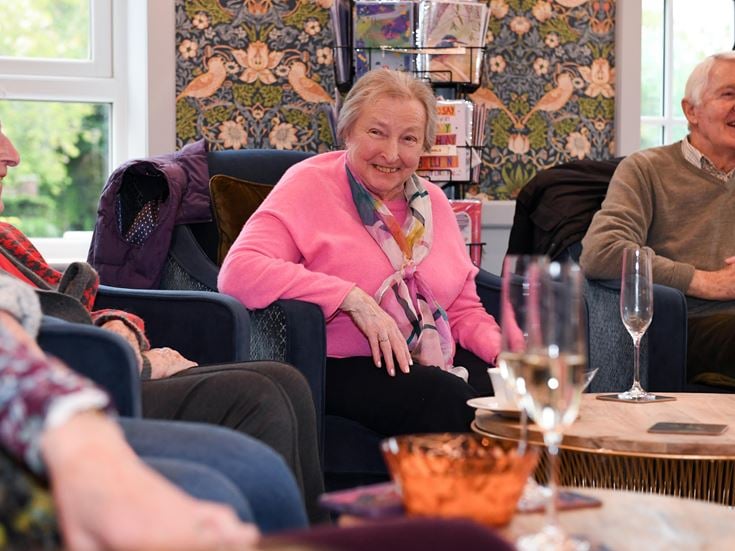 people sat on sofas in conversation