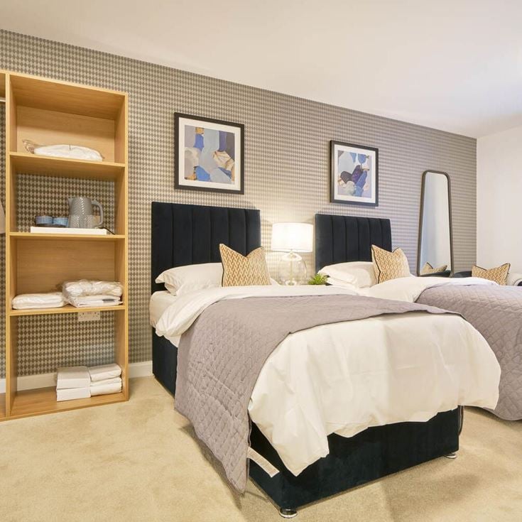 a bedroom with two beds