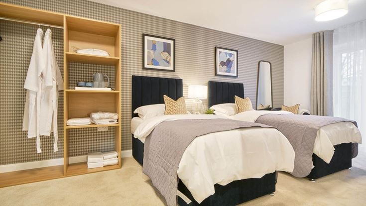 a bedroom with two beds