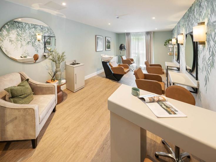 a living room with a table and chairs