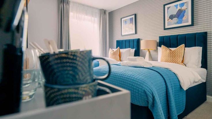 a bedroom with a bed and a mirror