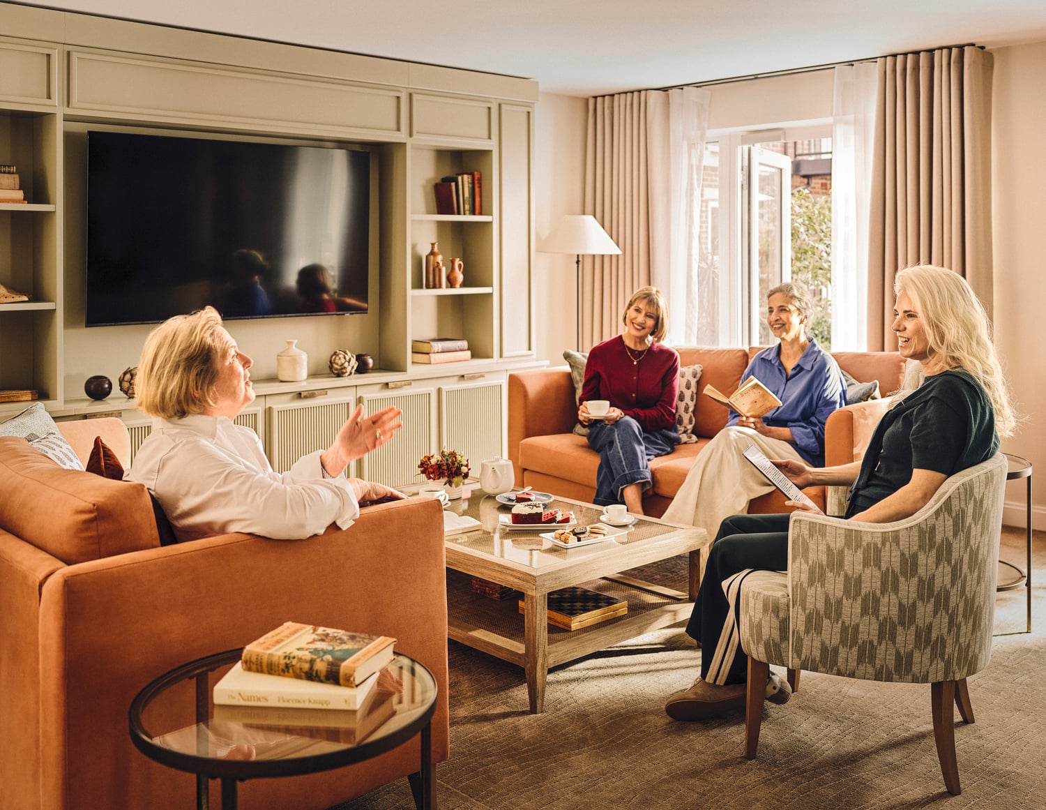 a group of people sitting in a living room