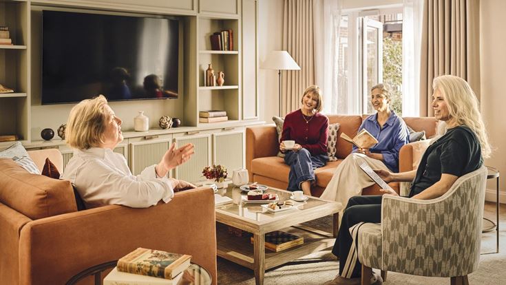 a group of people sitting in a living room