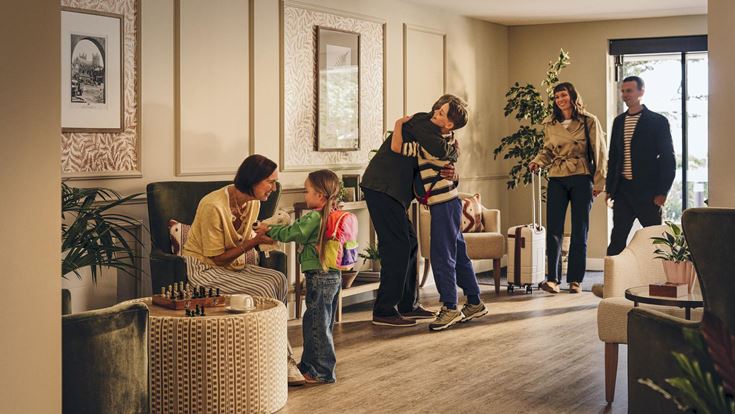 a group of people in a living room