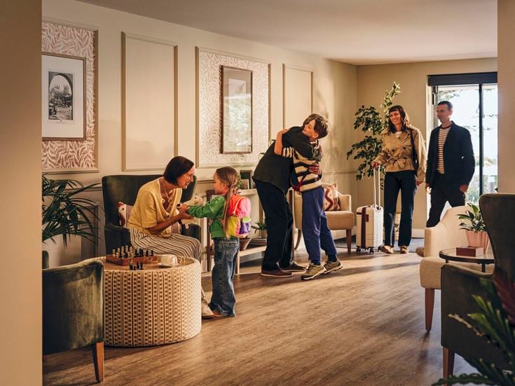 a group of people in a living room