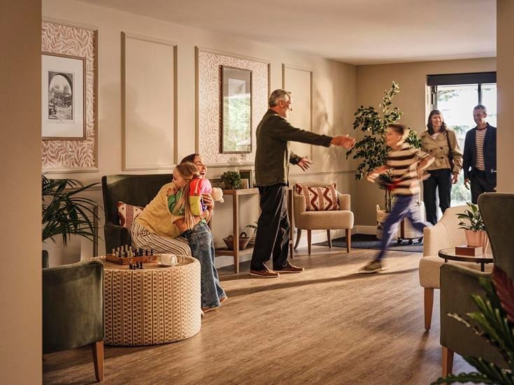 a group of people in a living room