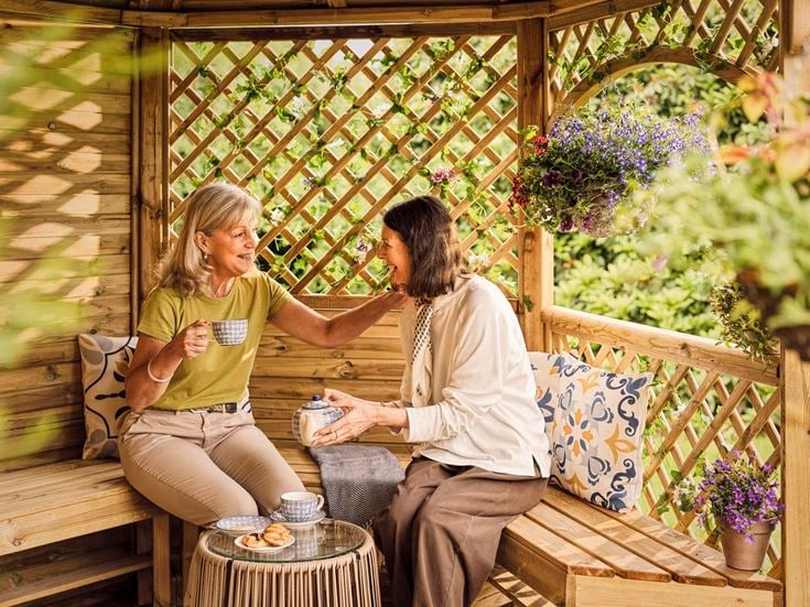 a man and a woman sitting on a bench