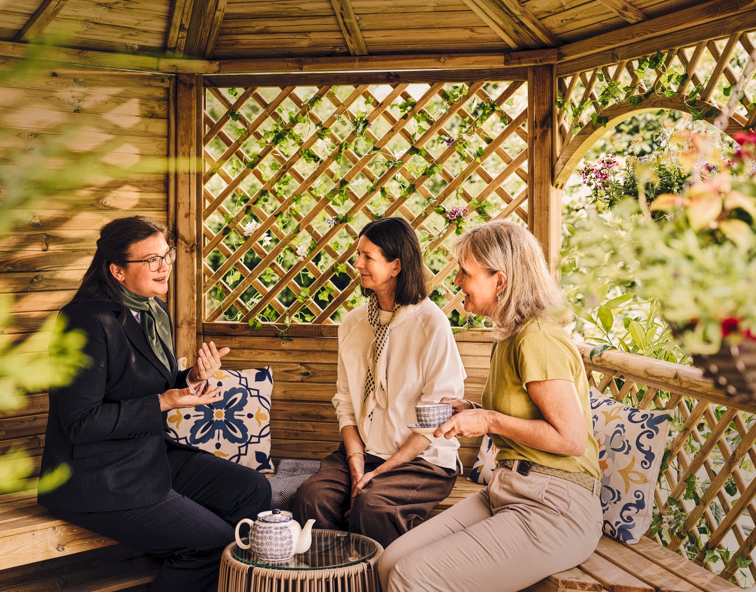 a group of women sitting on a bench