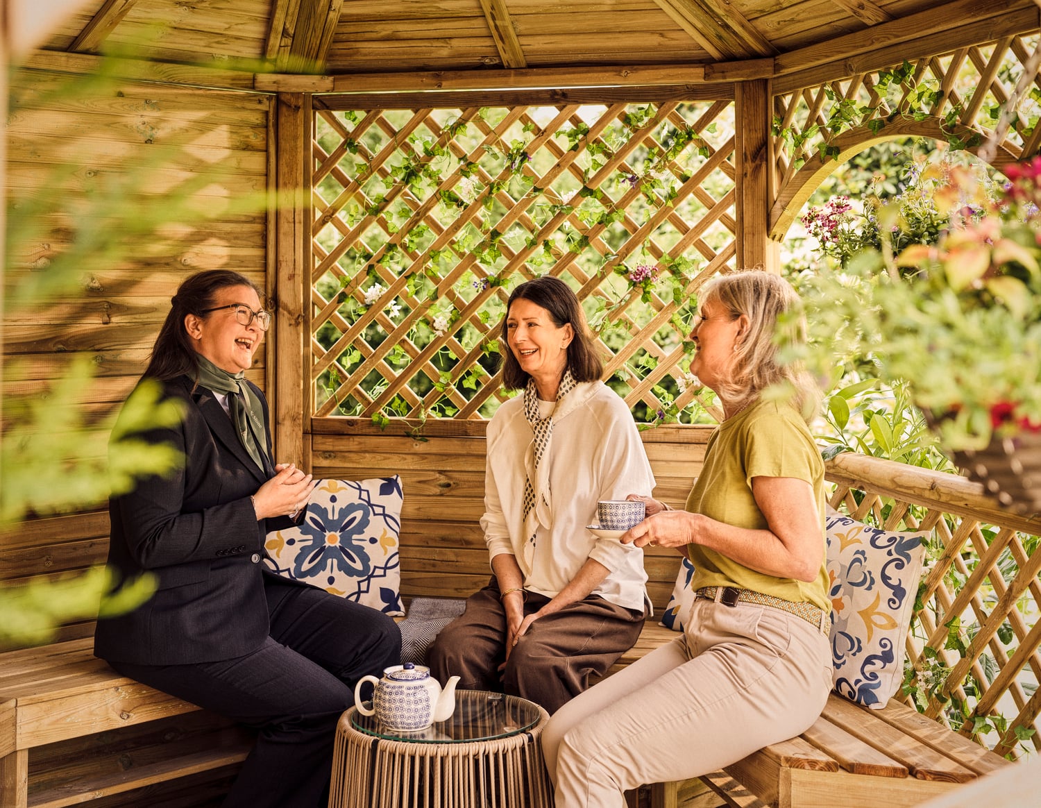 a group of women sitting on a bench