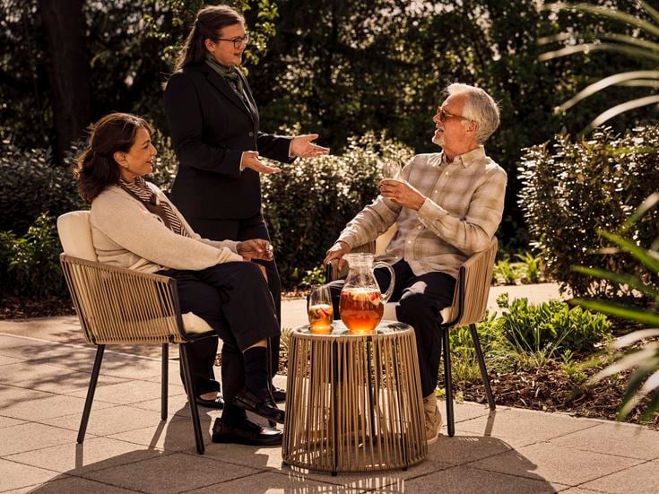 a group of people sitting outside