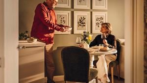 a man and a woman eating at a table