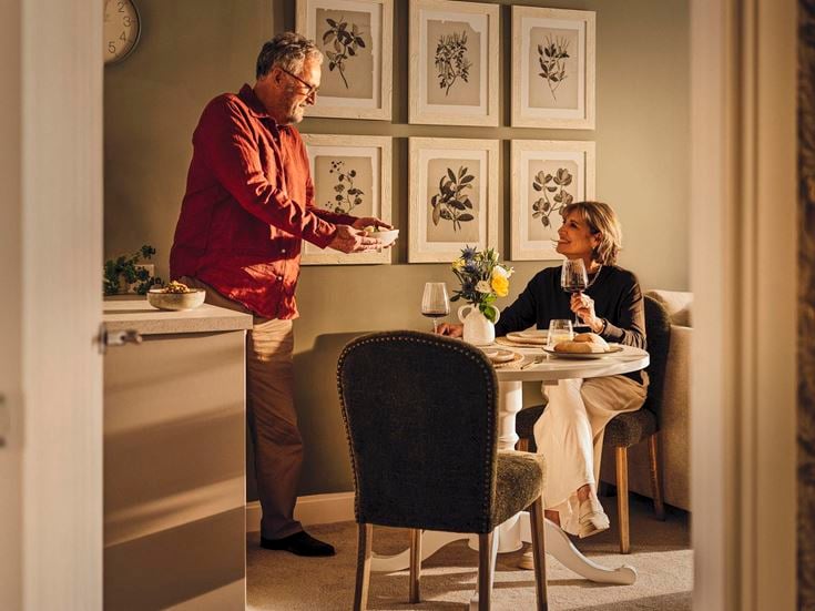 a man and a woman eating at a table