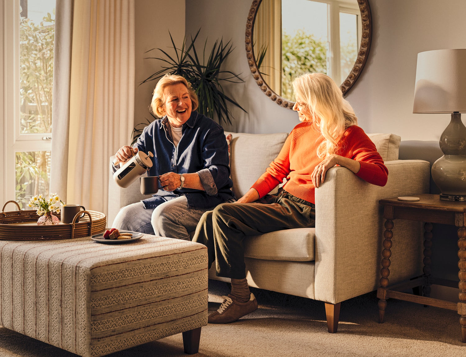 a person and a child sitting on a couch