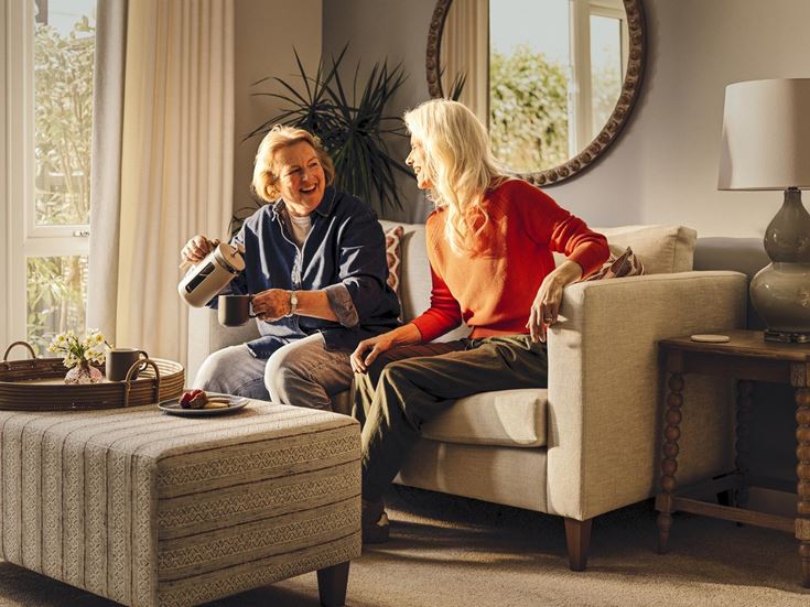 a woman and a man sitting on a couch