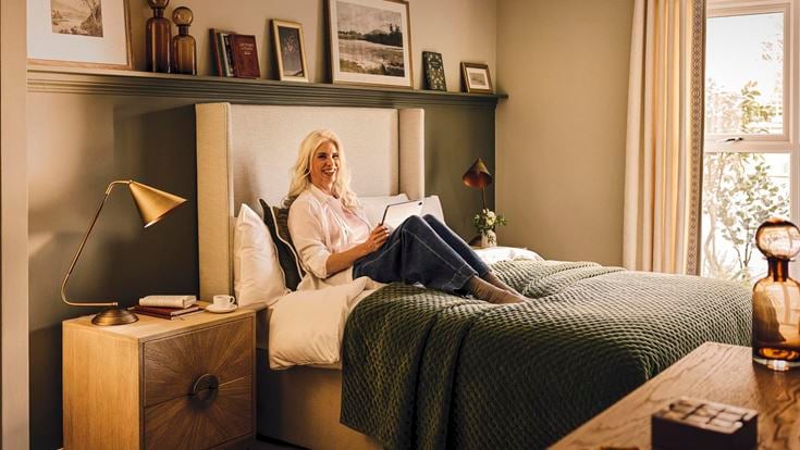 a person sitting on a bed