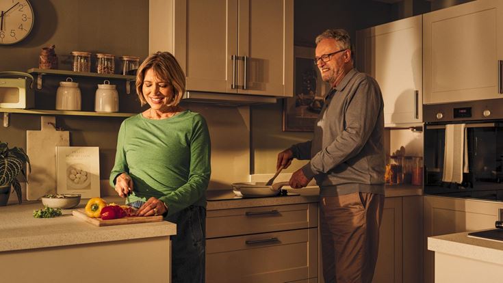 a man and a woman in a kitchen