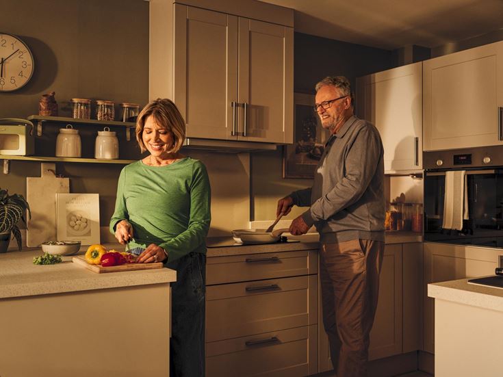 a man and a woman in a kitchen