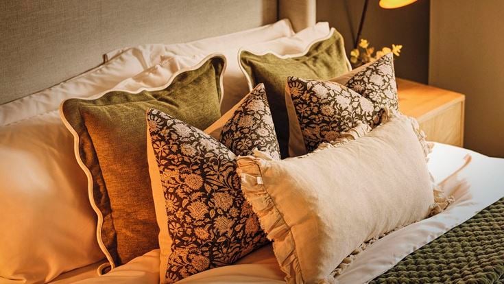 a bed with pillows