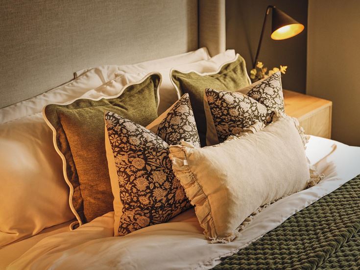 a bed with pillows