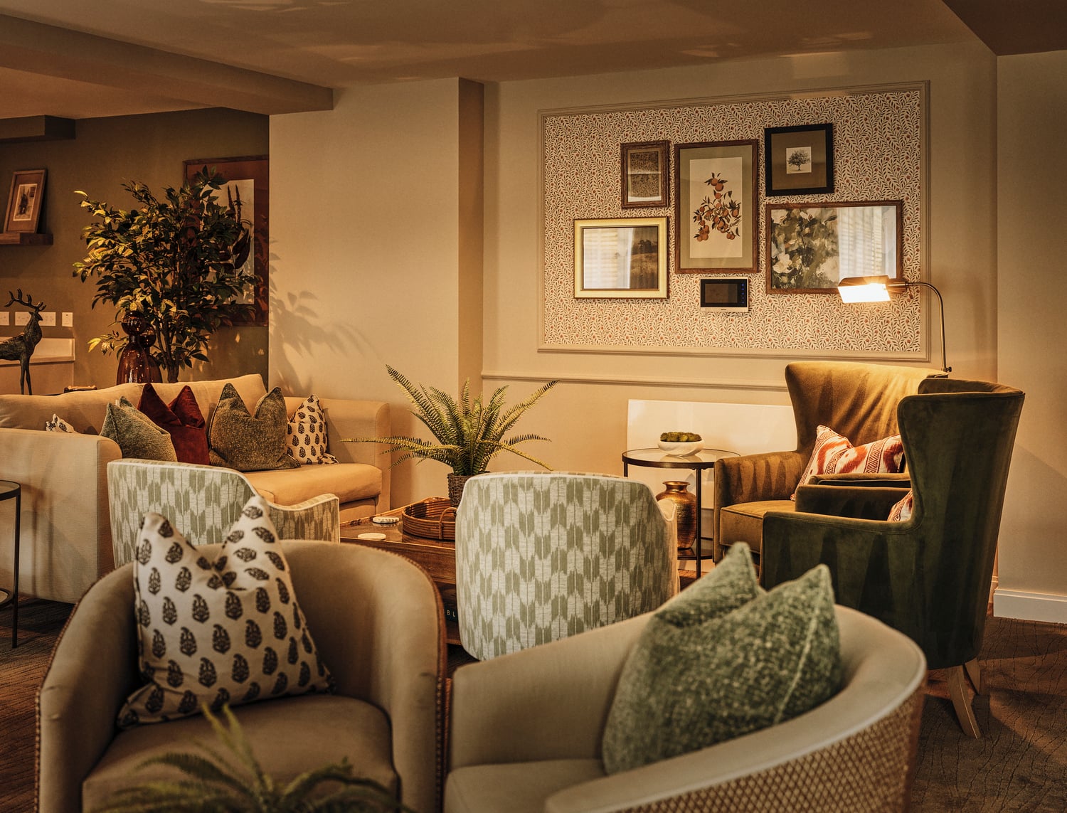 a living room with a couch and chairs