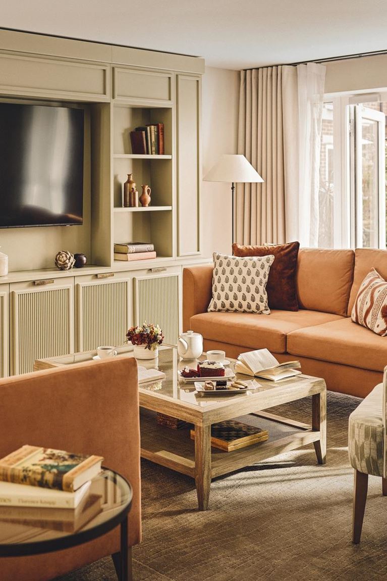 a living room with a tv and couches
