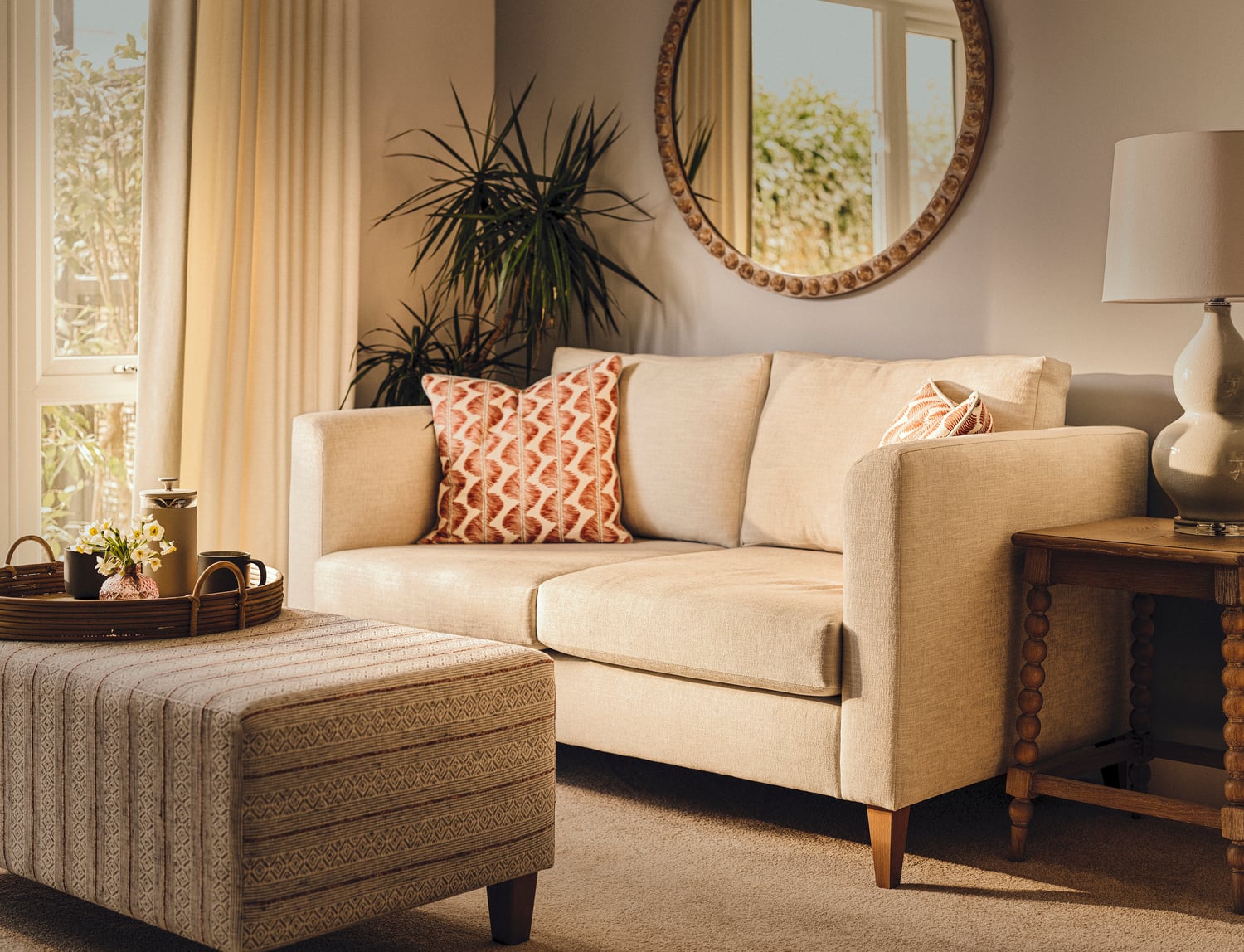 a white couch with pillows