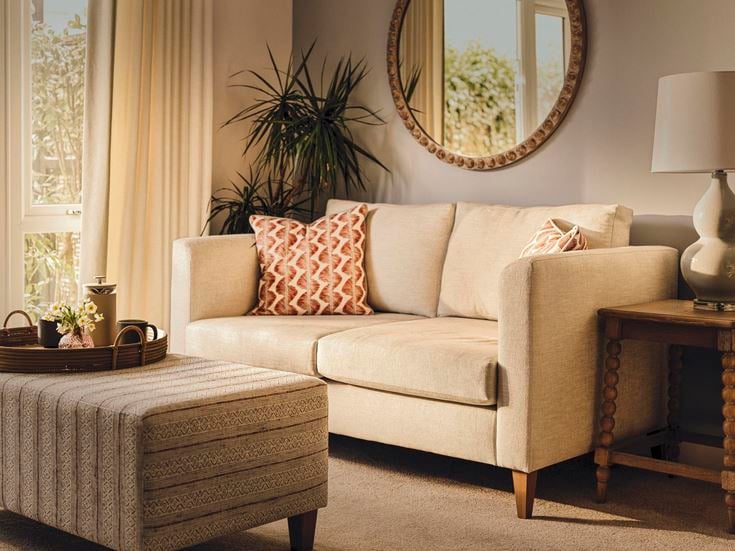 a white couch with pillows