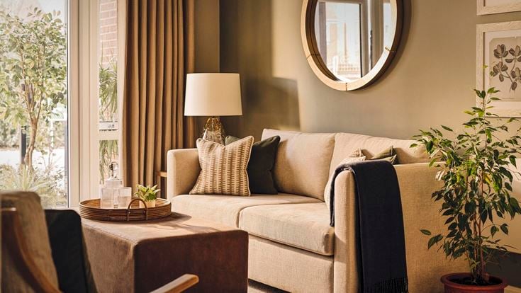 a living room with a couch and a table