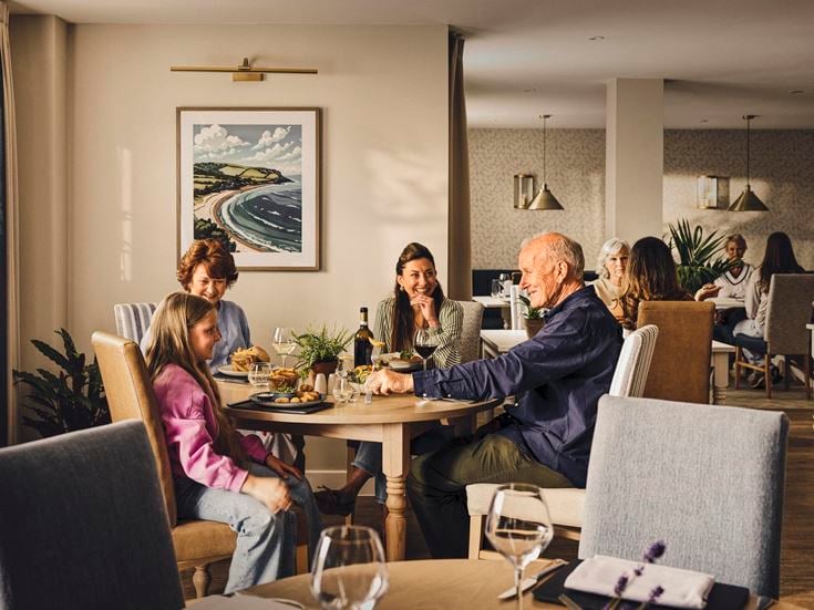 a group of people sitting around a table