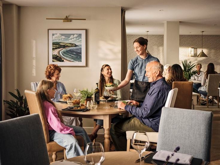 a group of people sitting around a table