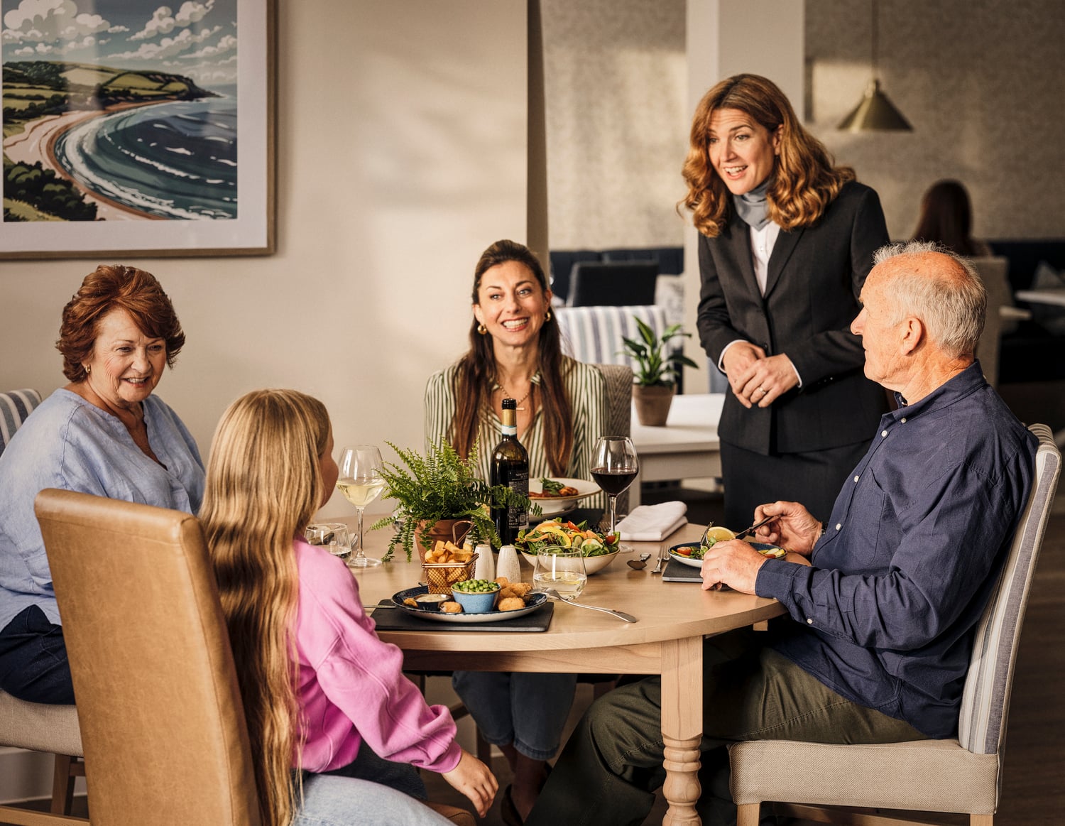 a group of people sitting around a table