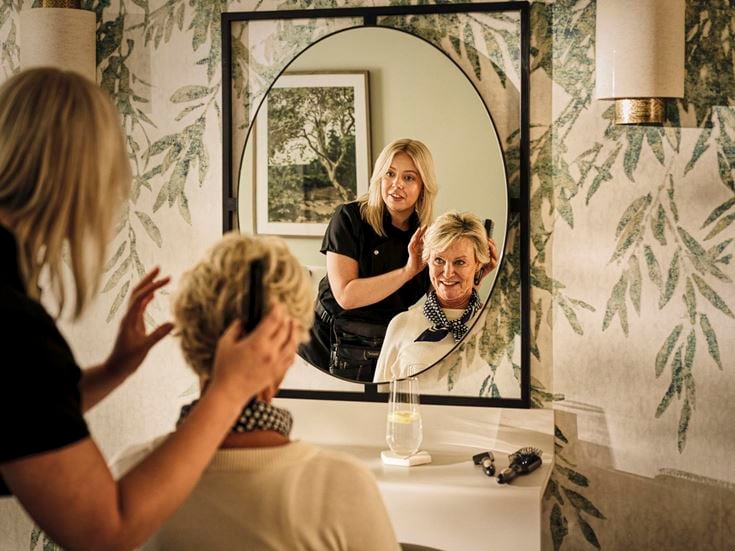 a person taking a selfie in a mirror