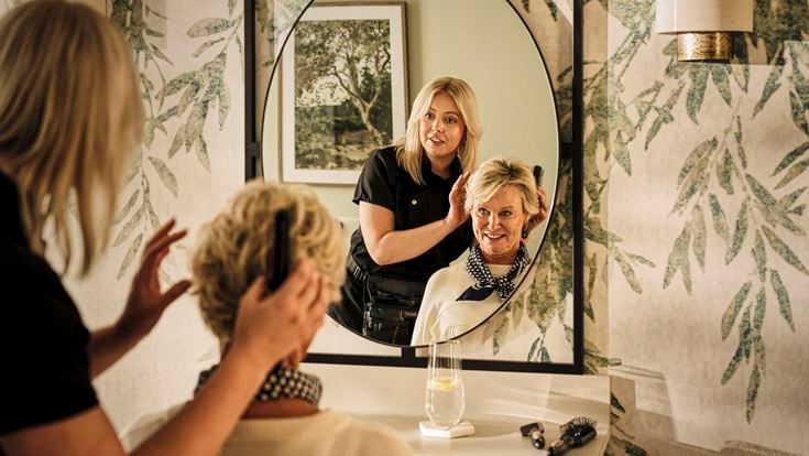 a person taking a selfie in a mirror