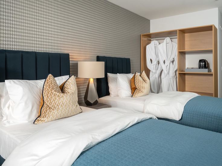 a bed with a blue blanket