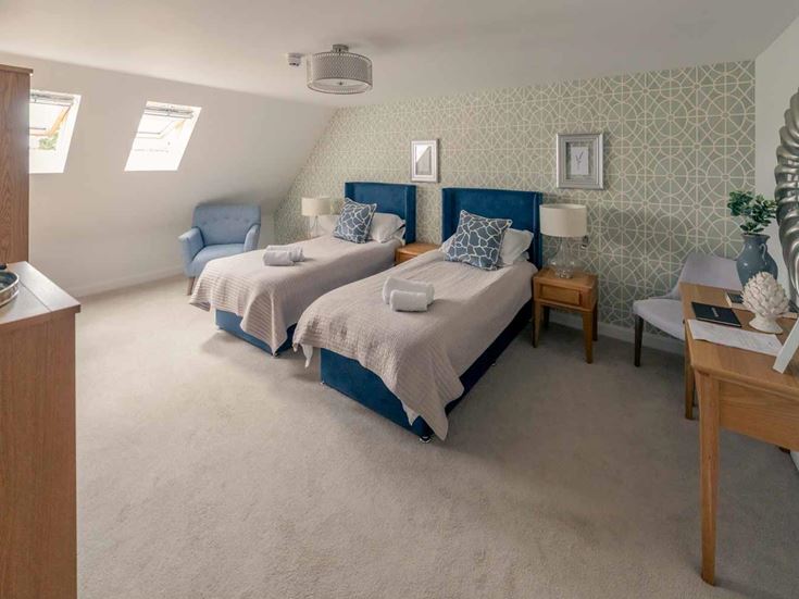 a bedroom with two beds