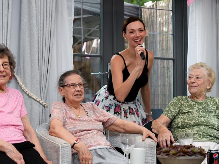a group of women sitting at a table