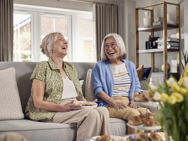 a couple of women laughing