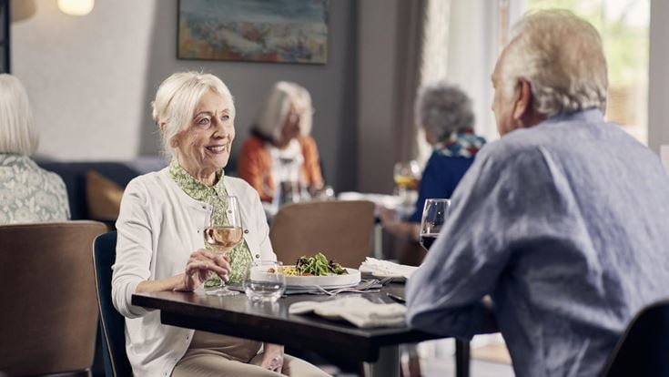 a group of people sitting at a table