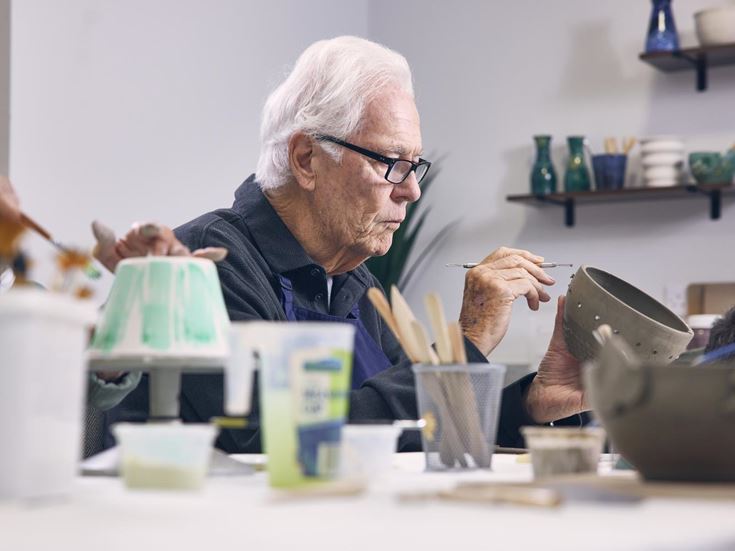 a man painting a picture