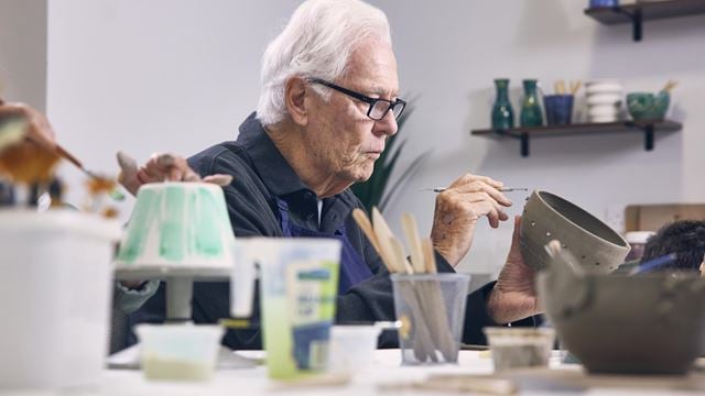 a man painting a picture