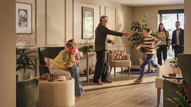 a group of people in a living room