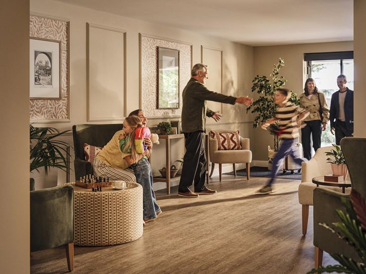 a group of people in a living room