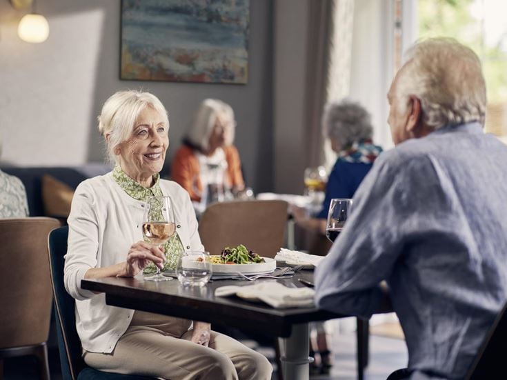a group of people sitting at a table