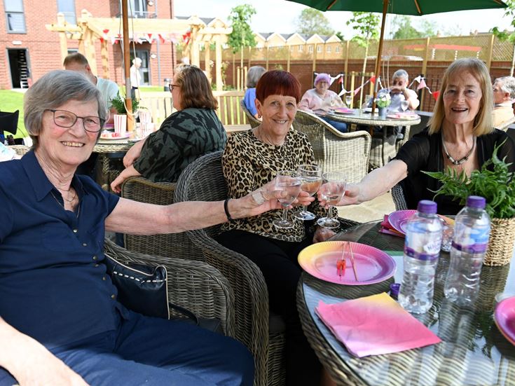 a group of women sitting at a table